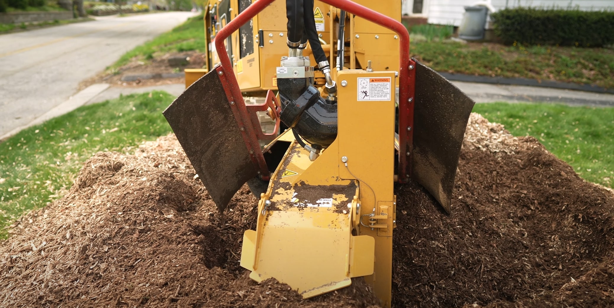 Professional stump grinding equipment removing tree stump in Missouri, TX